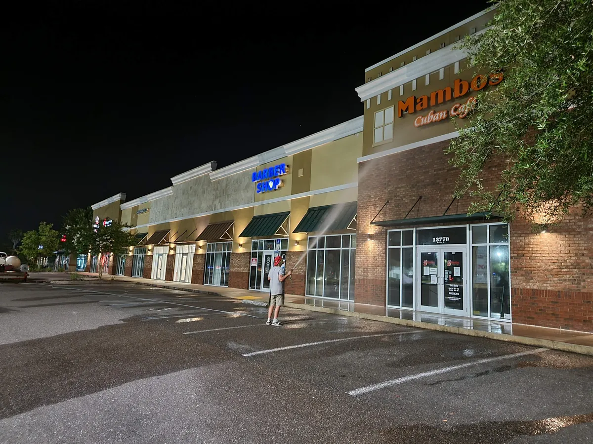 Night pressure washing of the retail center storefronts at 13770 Beach Boulevard, Jacksonville