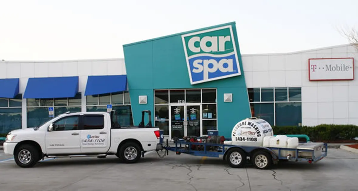 Car Spa storefront and T-Mobile plaza with the Safe Touch truck and pressure washing trailer on site in Jacksonville