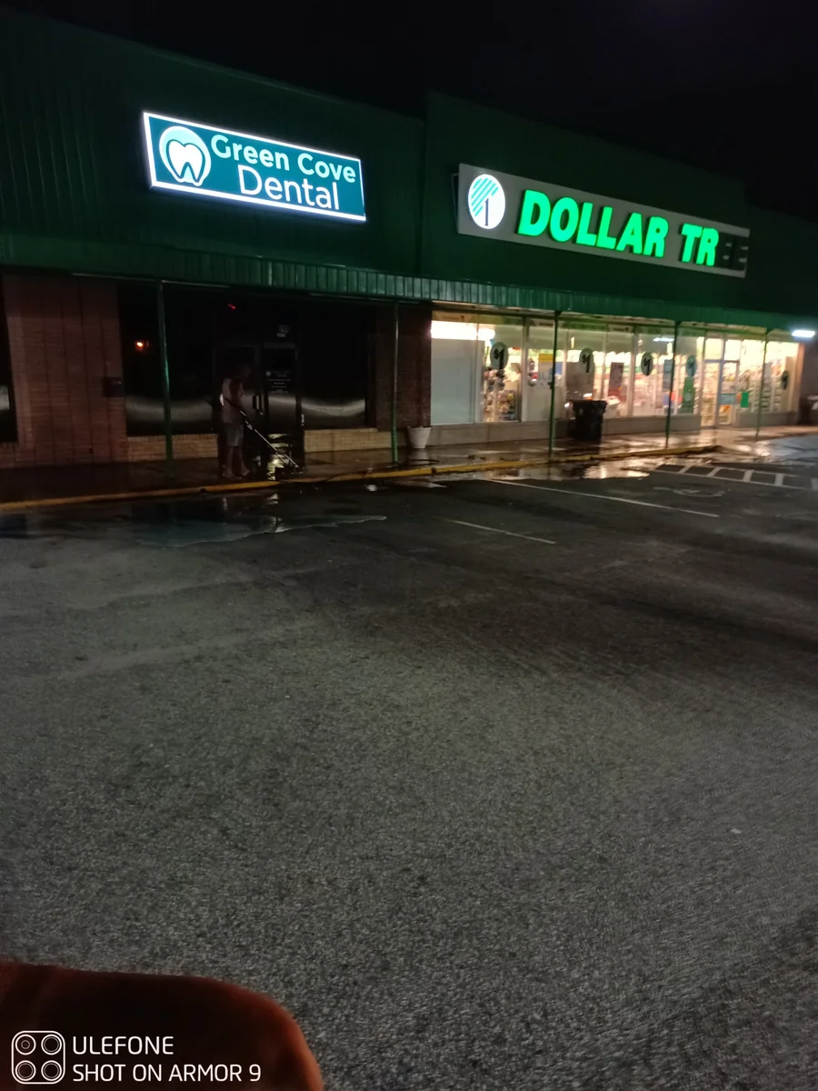 After-hours pressure washing outside Dollar Tree and Green Cove Dental in Green Cove Springs, FL