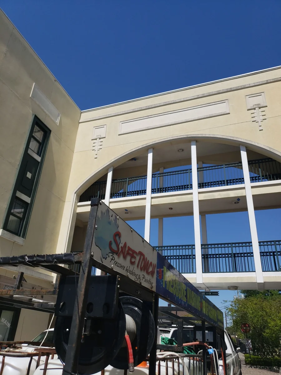 Safe Touch trailer beside a multi-story property with open-air walkways in Jacksonville
