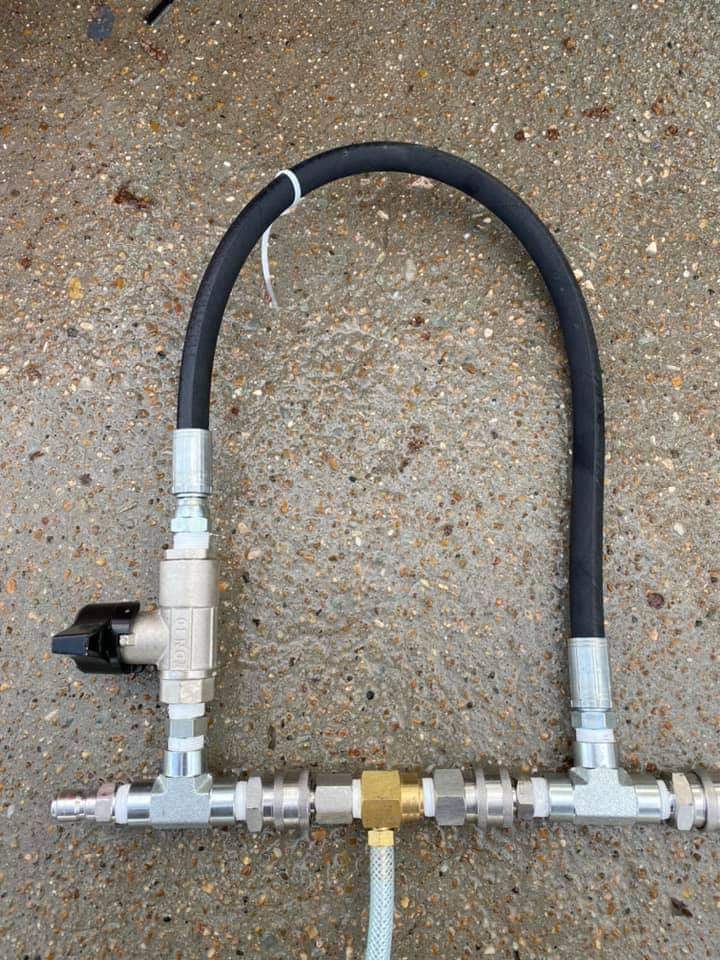 Charles’s injector bypass: a DN10 valve and looped hose bridge two tee fittings around the inline chemical injector.